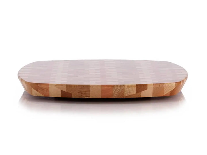 Front view of a rectangular end-grain lazy susan with rounded corners, featuring a geometric mosaic pattern in various shades of light and reddish-brown wood, on a white background