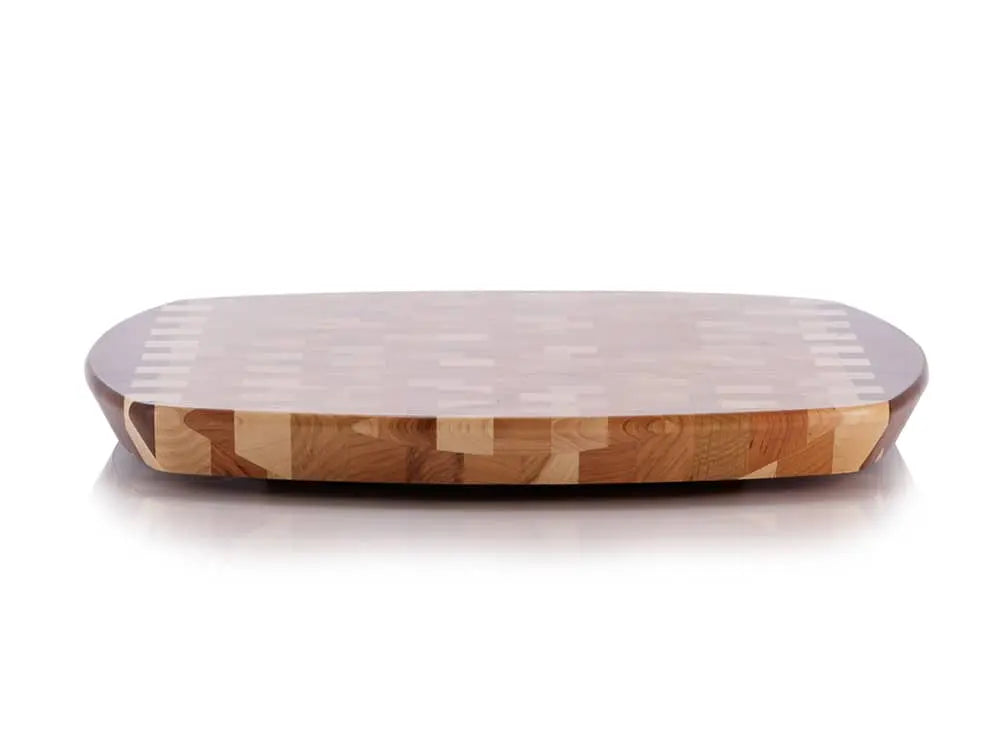 Front view of a rectangular end-grain lazy susan with rounded corners, featuring a geometric mosaic pattern in various shades of light and dark brown wood, on a white background