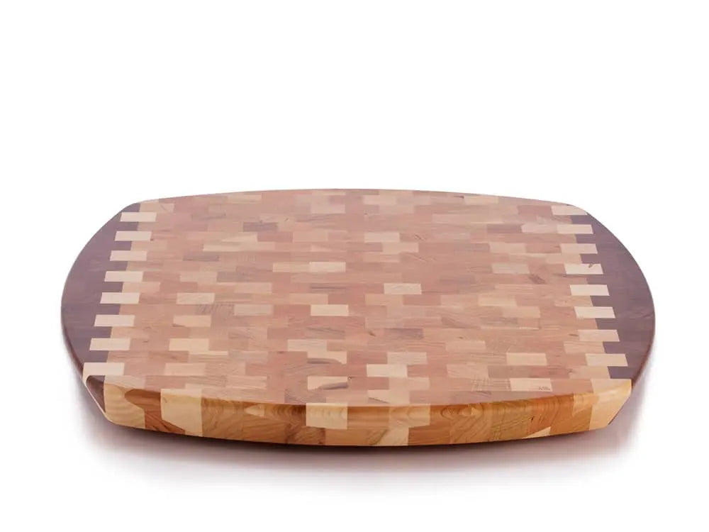 Top view of a rectangular end-grain lazy susan with rounded corners, featuring a geometric mosaic pattern in various shades of light and dark brown wood, on a white background