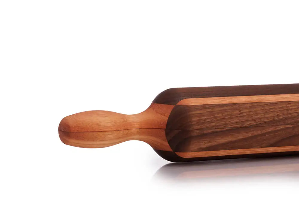 Boston Rolling Pin detailed handle, featuring a black walnut body with a red grandis accent, showing the fine craftsmanship and smooth finish of the handle