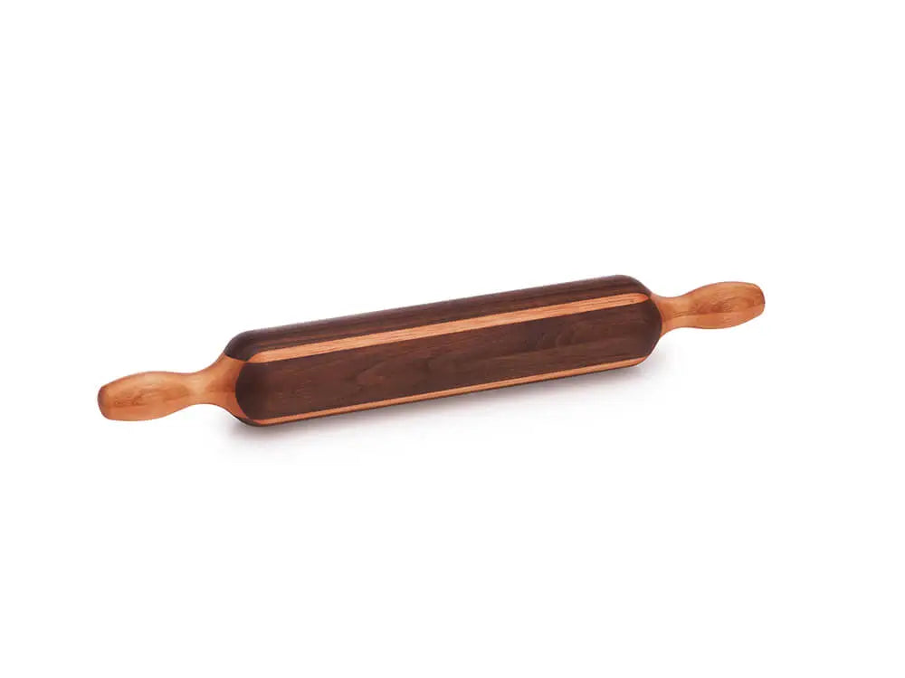 Boston Rolling Pin made of black walnut with a red grandis accent, viewed from the top front. The rolling pin is 18 inches long, with a diameter of 2 ½ inches, featuring handles on both ends