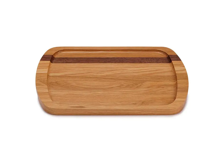 Top view of the Brookfield Prairie Lane Serving Tray, crafted from ¾-inch thick solid light oak wood with a darker wood accent stripe, featuring rounded edges and finger slots, on a white background