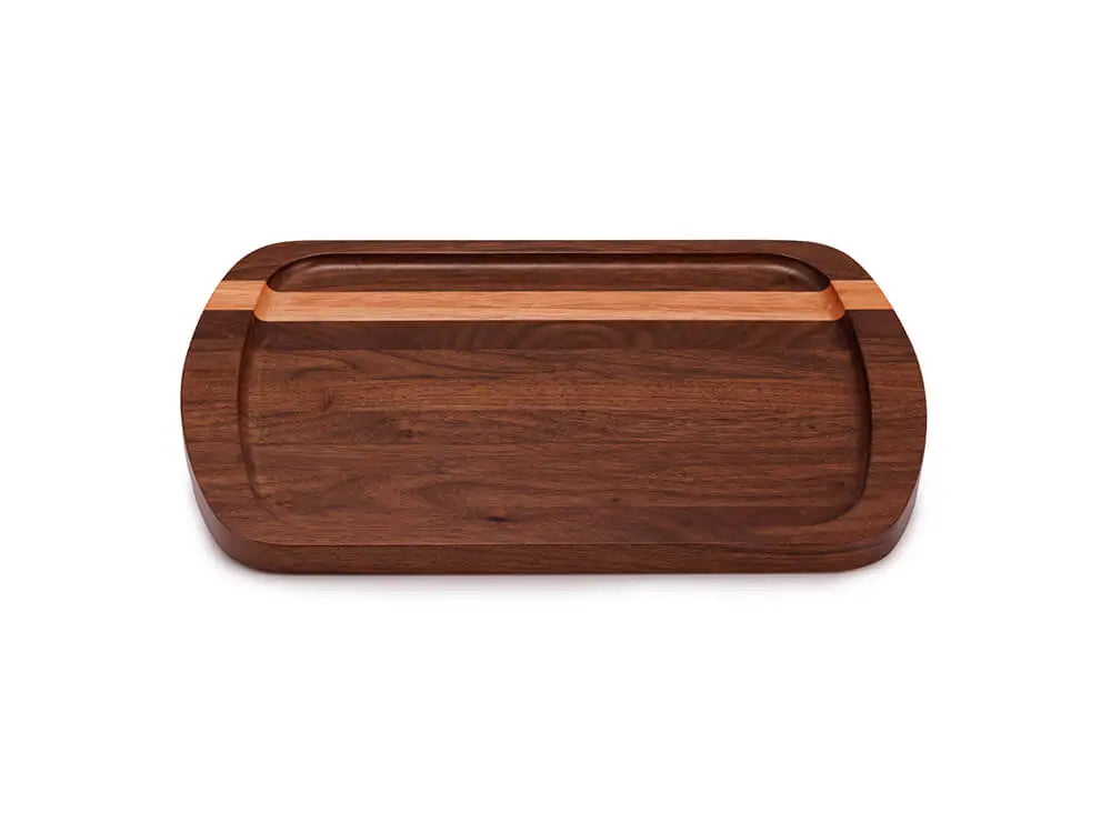 Top view of the Brookfield Serving Tray, crafted from ¾-inch thick solid wood with a dark walnut finish and a lighter wood accent stripe, featuring rounded edges and finger slots, on a white background