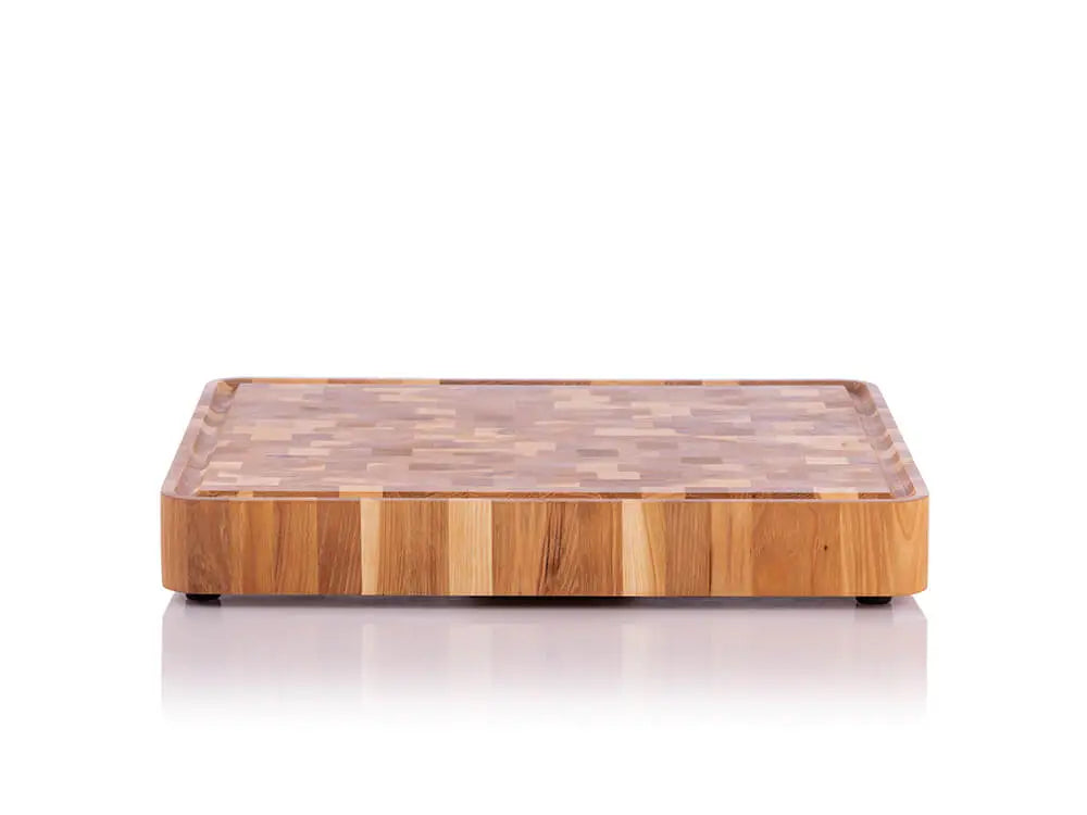 Front view of a hickory nut end grain butcher block with a checkered pattern and a juice groove, against a white background