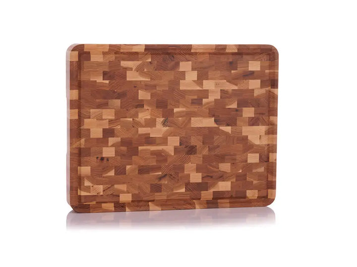 Standing view of a hickory nut end grain butcher block with a checkered pattern and a juice groove, against a white background