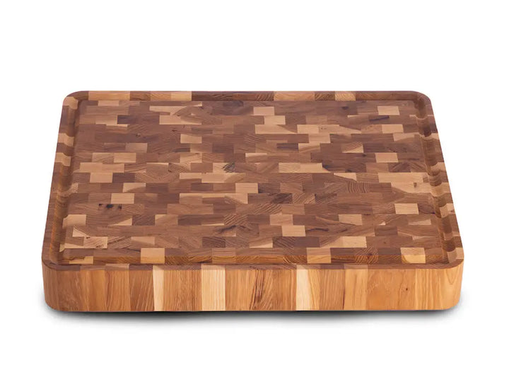 Top view of a hickory nut end grain butcher block with a checkered pattern and a juice groove, against a white background
