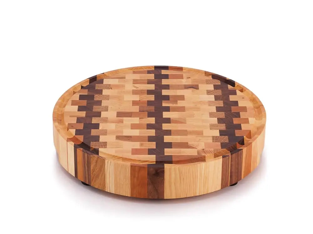 Round end grain butcher block with a checkered pattern, shown from a high angle, on a white background