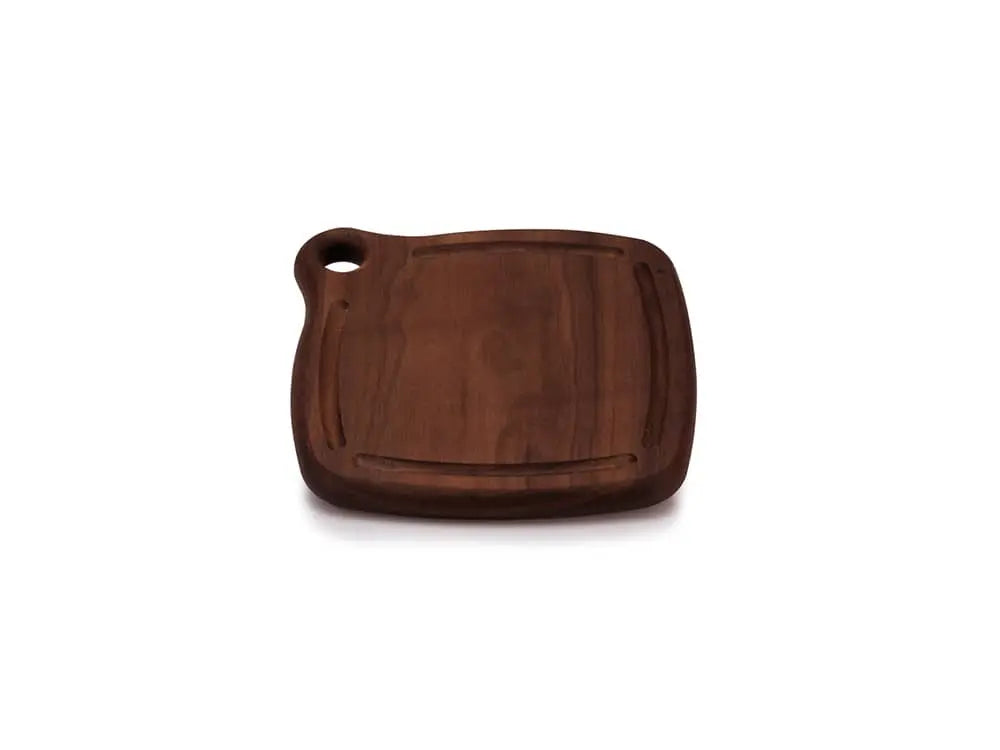 Top view of the Iron Wood Trivet, made from dark walnut wood with a smooth, glossy finish. The trivet features a grommet hole for hanging and is displayed on a white background