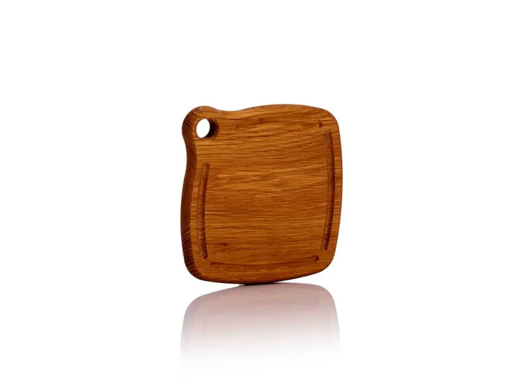 Iron Wood White Oak Trivet, standing front view. Features a smooth finish with a grommet hole for hanging