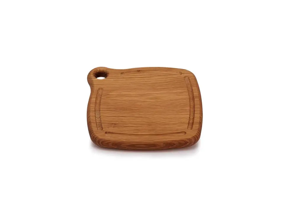Iron Wood White Oak Trivet, top view. The trivet features a single board design with a natural finish, rounded edges, and a grommet hole in the upper left corner for easy hanging