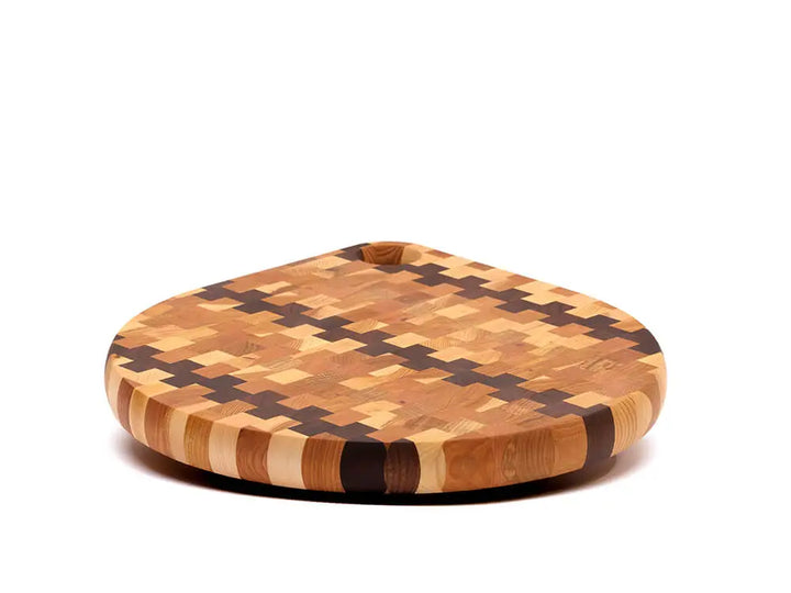 Front view of an end-grain charcuterie board board with a checkered pattern of various wood tones, featuring a smooth finish, against a white background