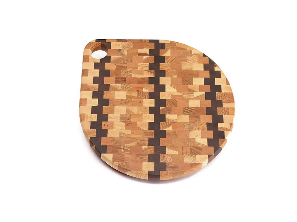 Top view of ant end-grain charcuterie board with a checkered pattern of various wood tones, featuring a smooth finish, against a white background